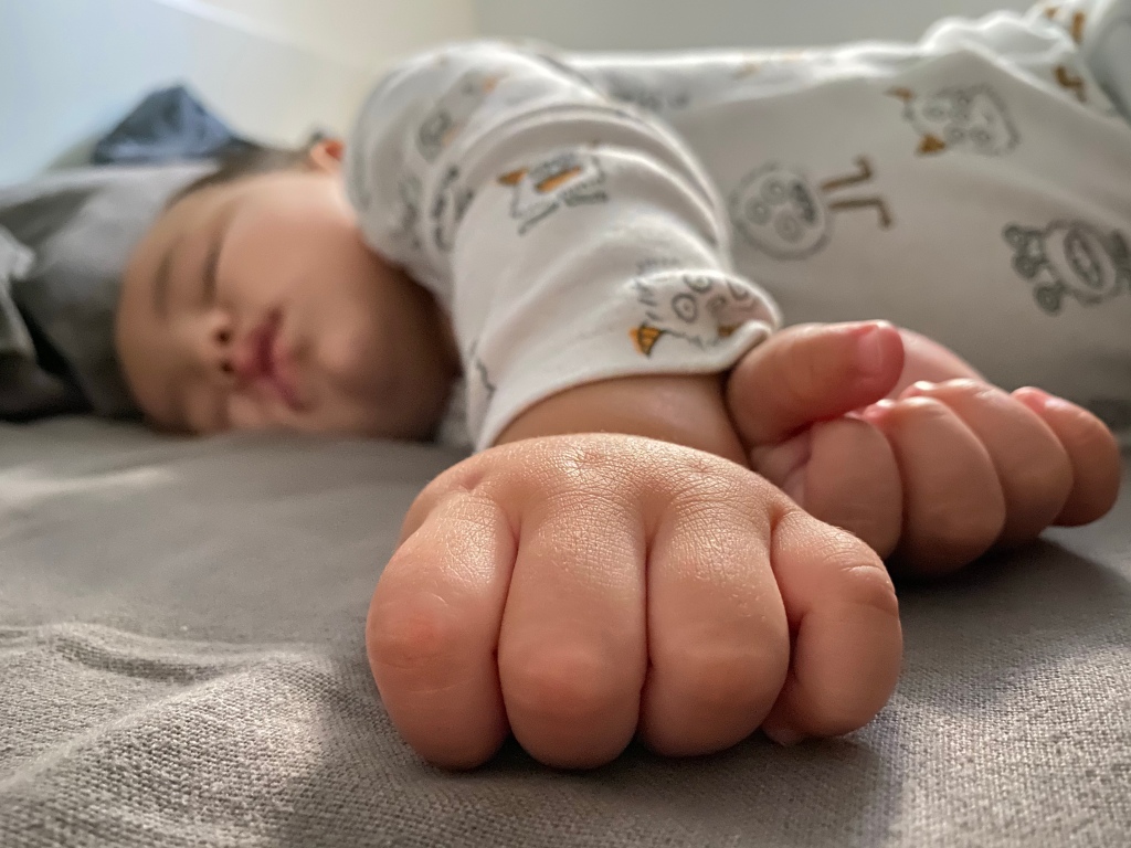 Sleeping baby on a bed